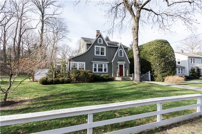 879 Bronson Road Fairfield, CT 06824 - Photo 1 of 1 a front view of a house with a yard