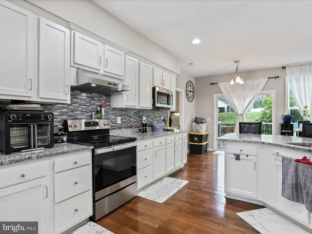 a view of a chairs and table on the wooden floor