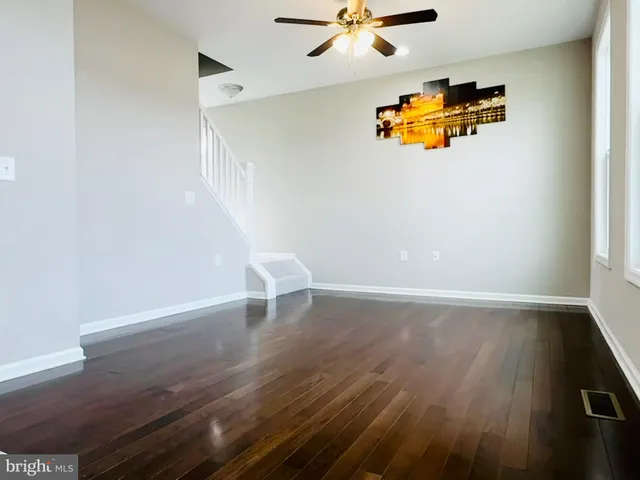 a bedroom with a bed and large window