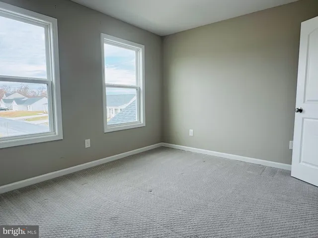 a view of empty room with windows