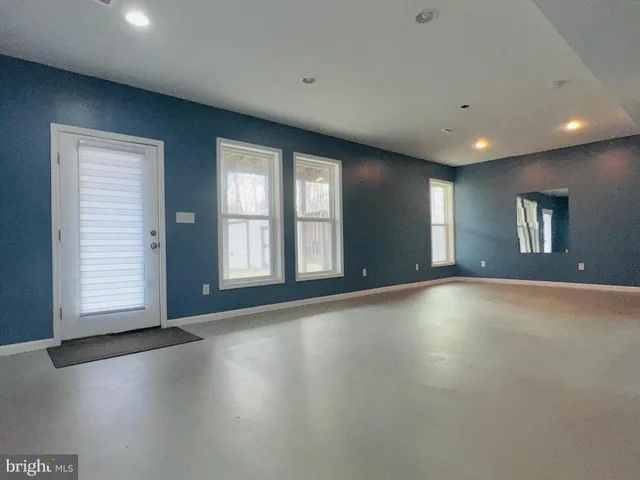 a front view of a house with large windows
