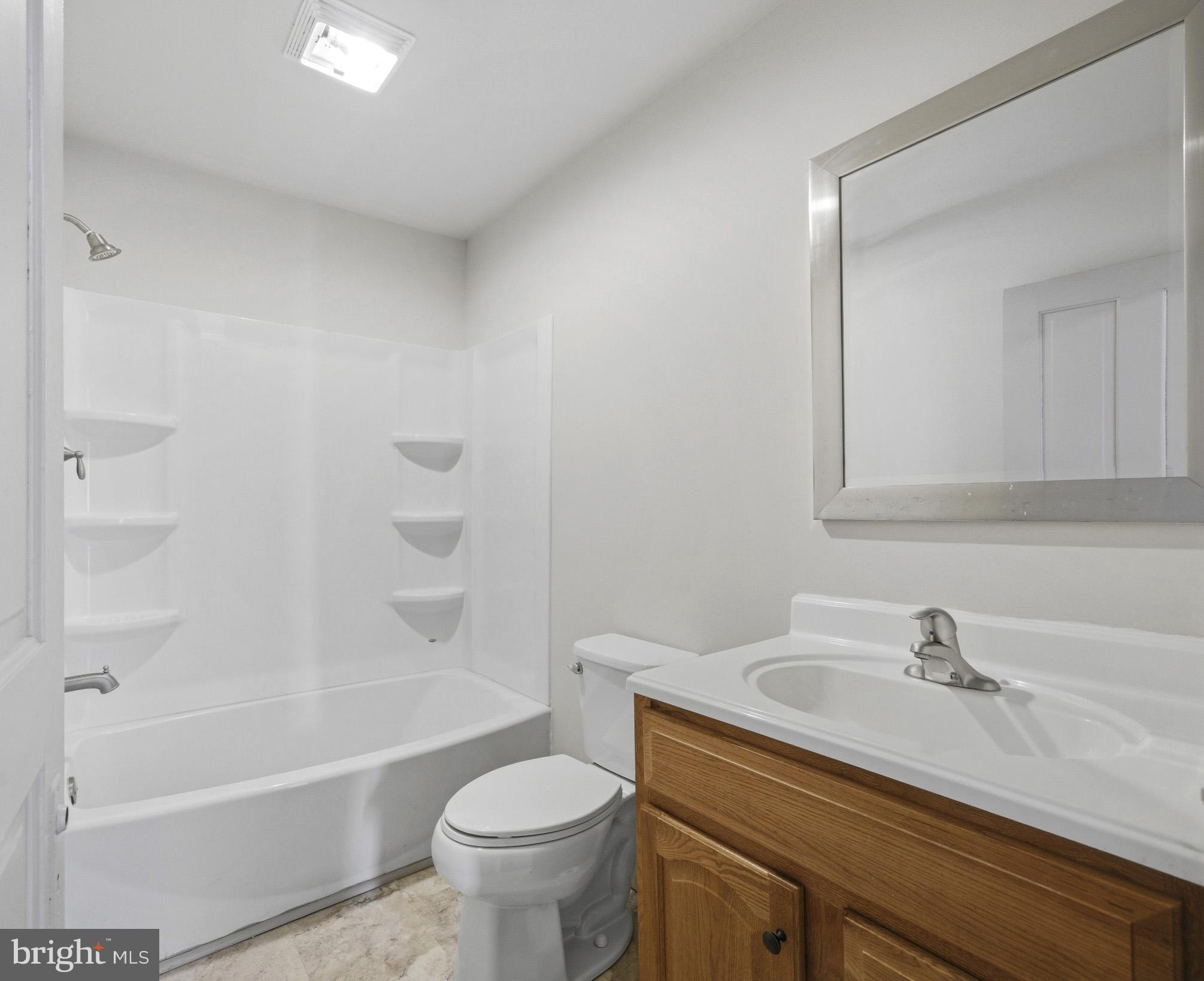 131 West Middle Street Gettysburg, PA 17325 - Photo 24 of 47 a bathroom with a sink a toilet and a bathtub