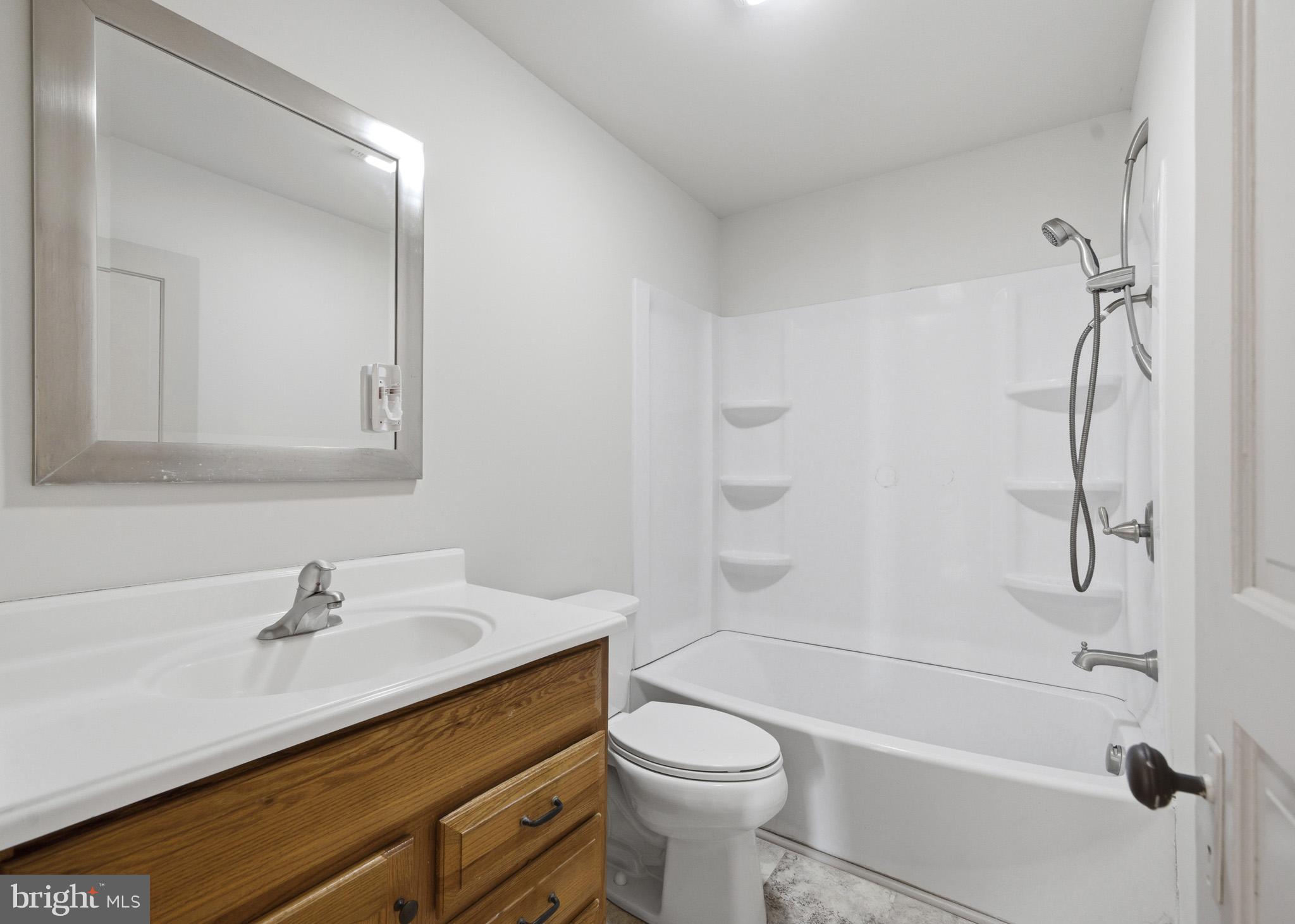 131 West Middle Street Gettysburg, PA 17325 - Photo 44 of 47 a bathroom with a sink a toilet and shower