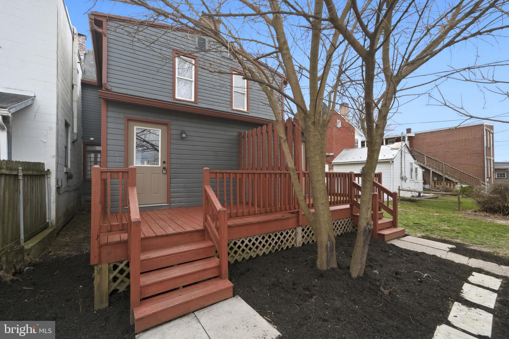 131 West Middle Street Gettysburg, PA 17325 - Photo 5 of 47 a view of a wooden deck and a yard with the trees
