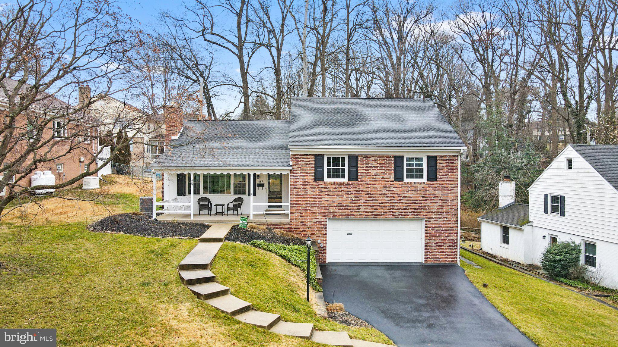 487 Kerr Lane Springfield, PA 19064 - Photo 1 of 48 a view of a house with backyard and sitting area