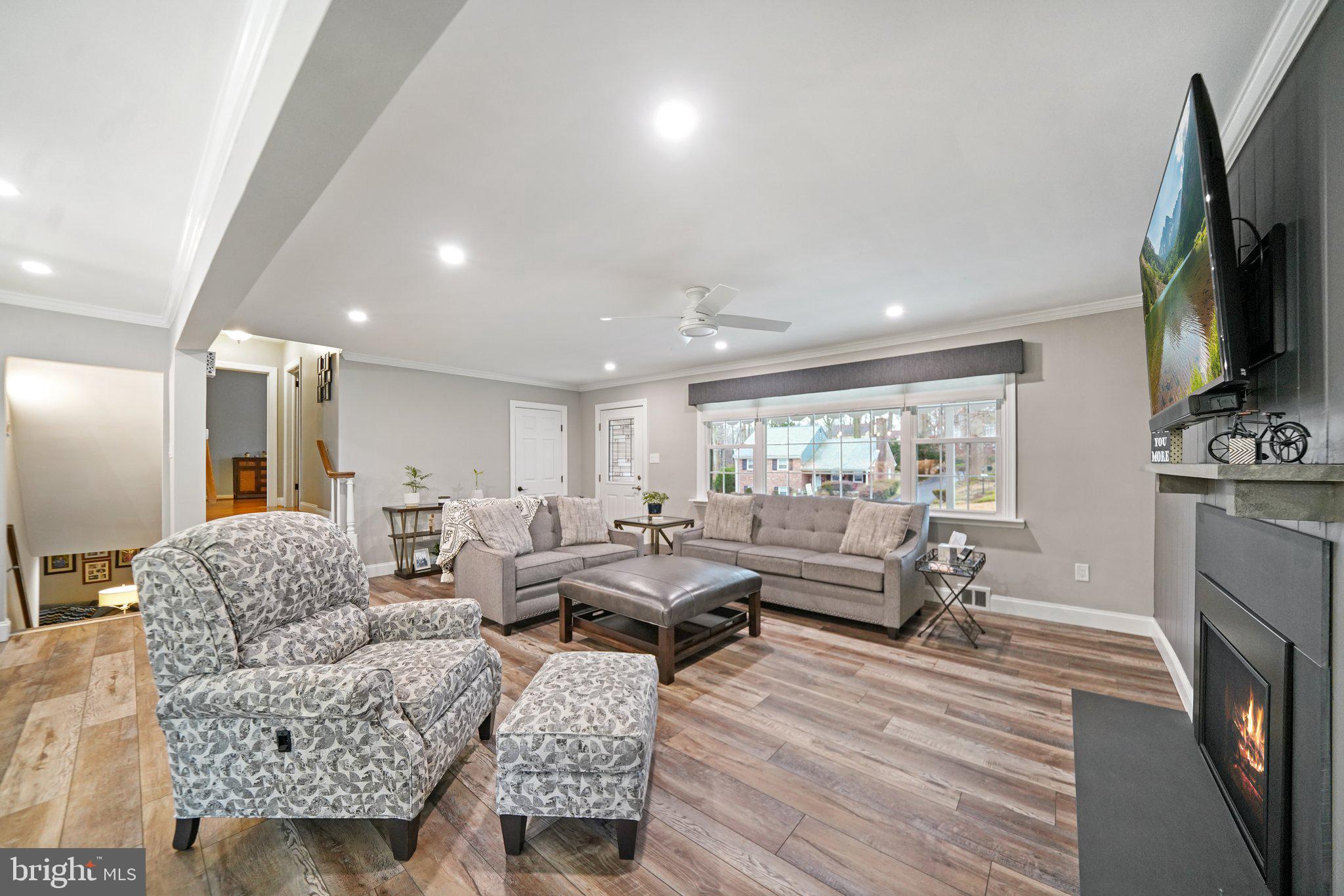 487 Kerr Lane Springfield, PA 19064 - Photo 12 of 48 a living room with fireplace furniture and a flat screen tv