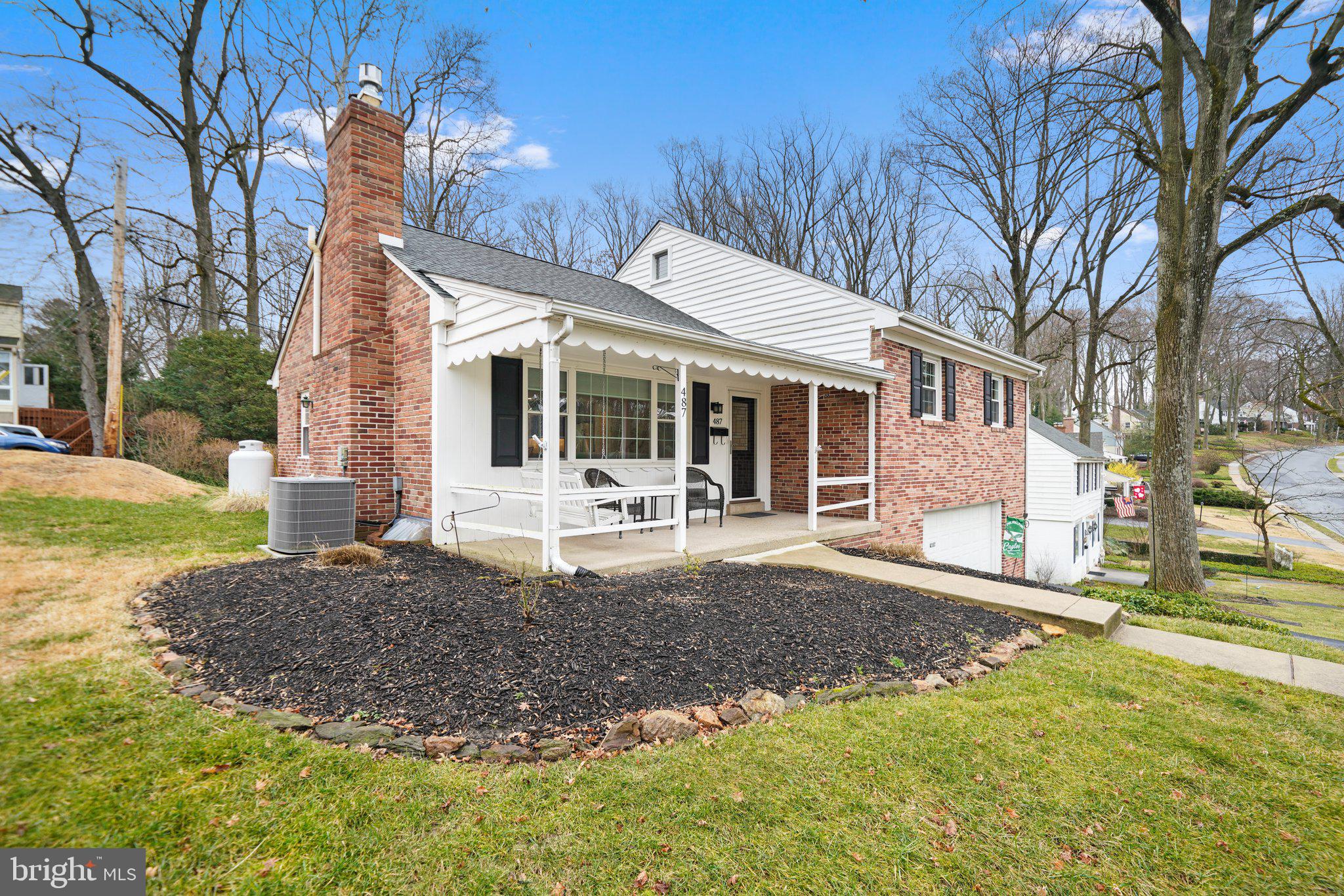 487 Kerr Lane Springfield, PA 19064 - Photo 2 of 48 a front view of a house with a yard and potted plants