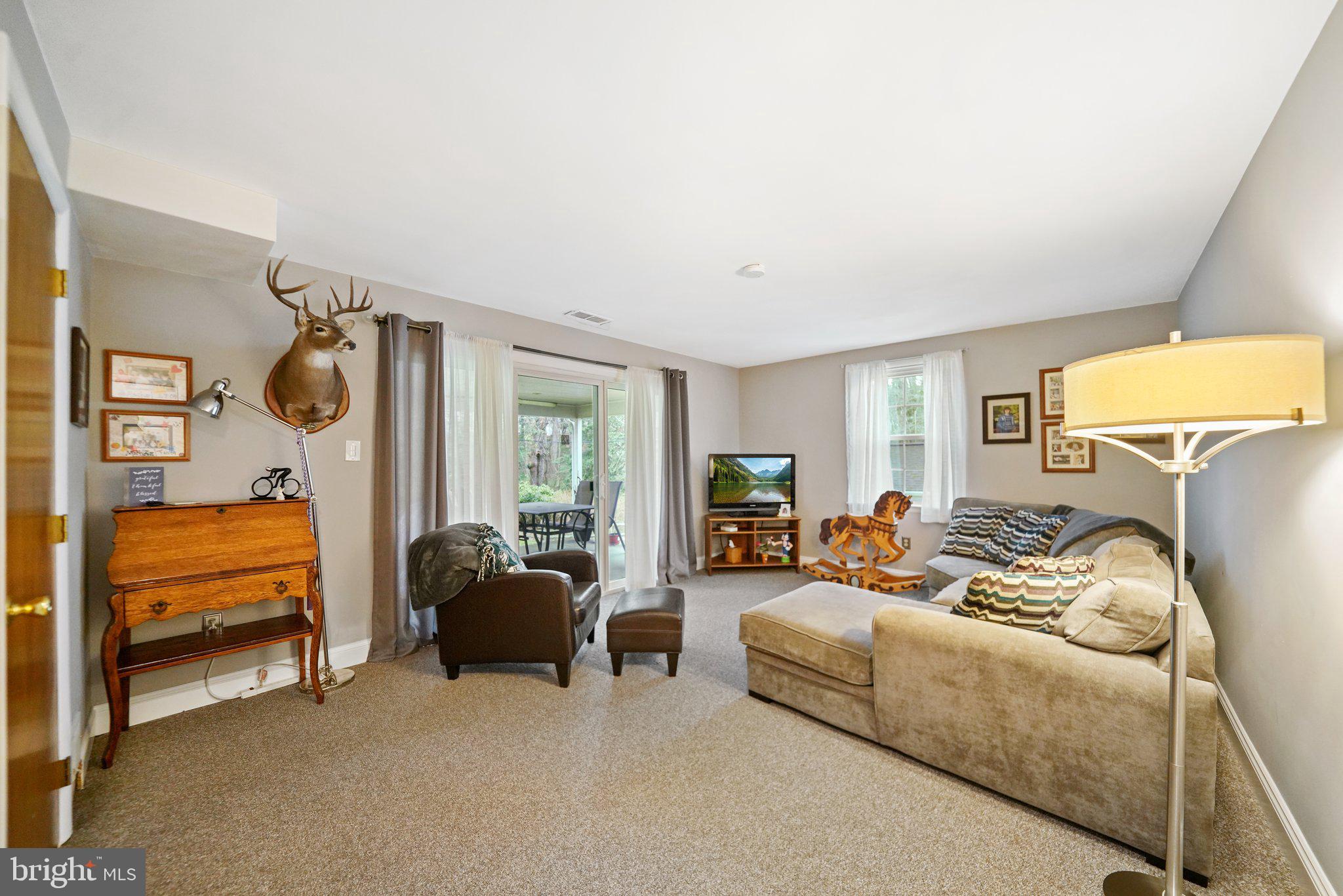 487 Kerr Lane Springfield, PA 19064 - Photo 22 of 48 a living room with furniture and a lamp