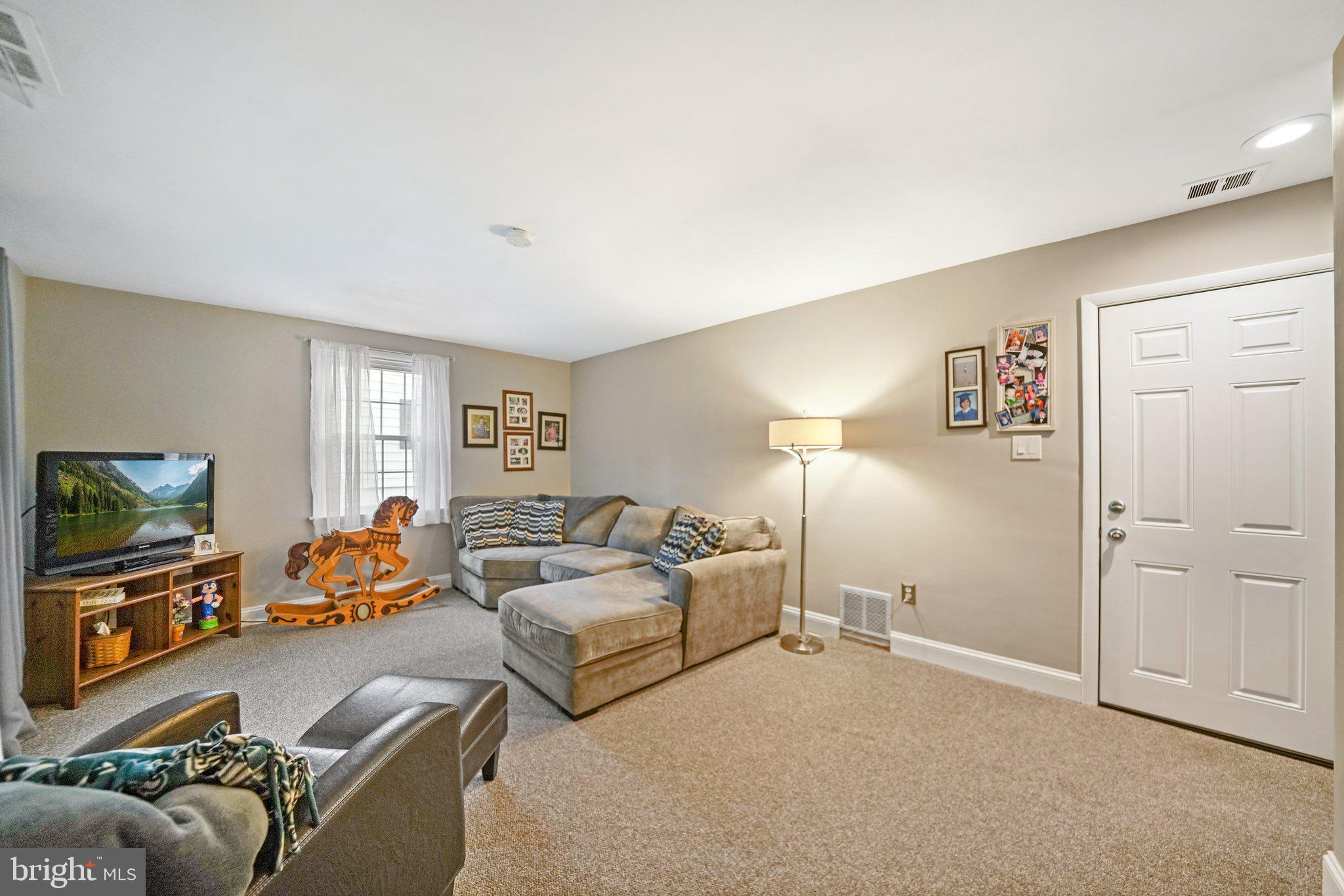 487 Kerr Lane Springfield, PA 19064 - Photo 23 of 48 a living room with furniture and a flat screen tv