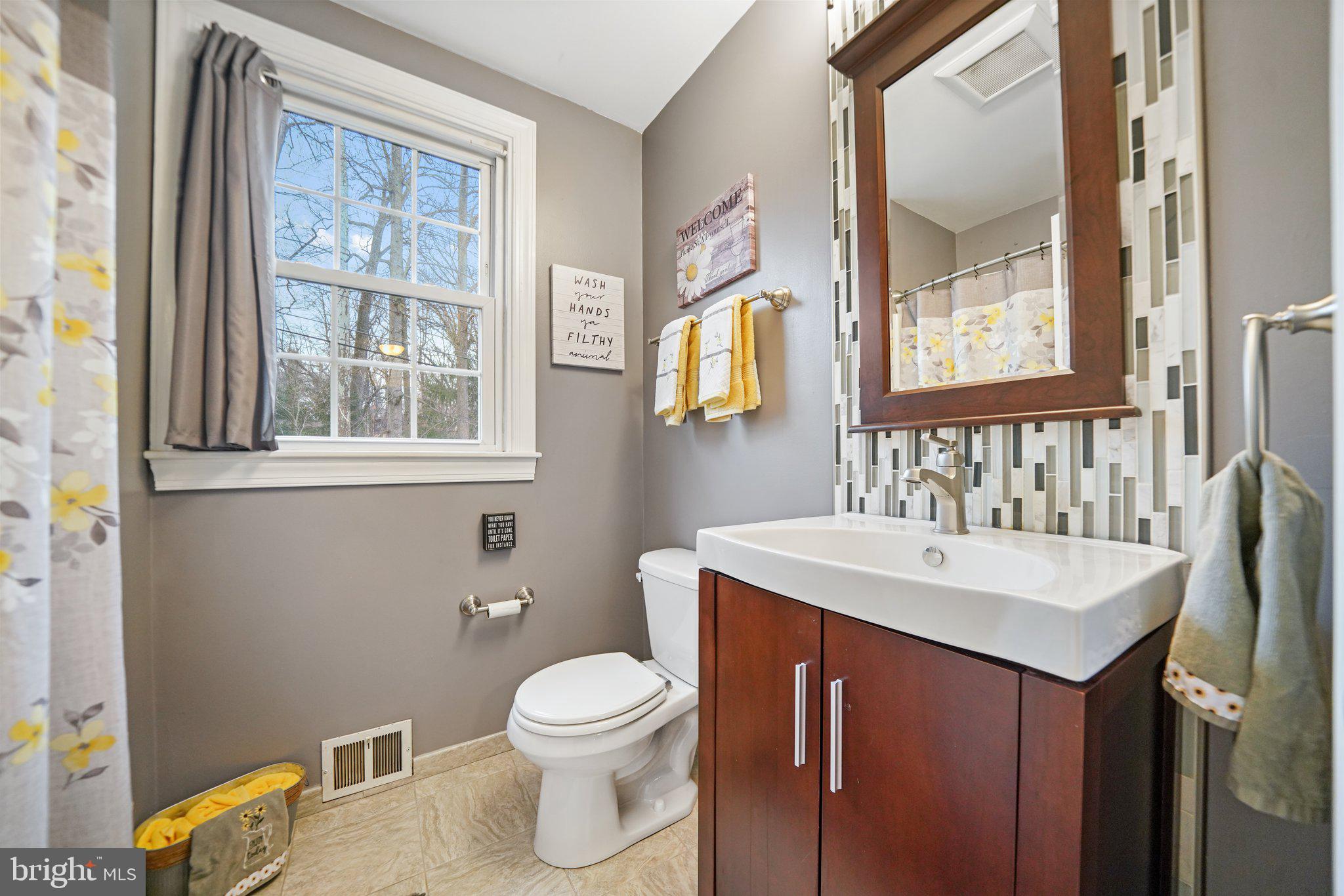 487 Kerr Lane Springfield, PA 19064 - Photo 24 of 48 a bathroom with a sink a toilet and a mirror