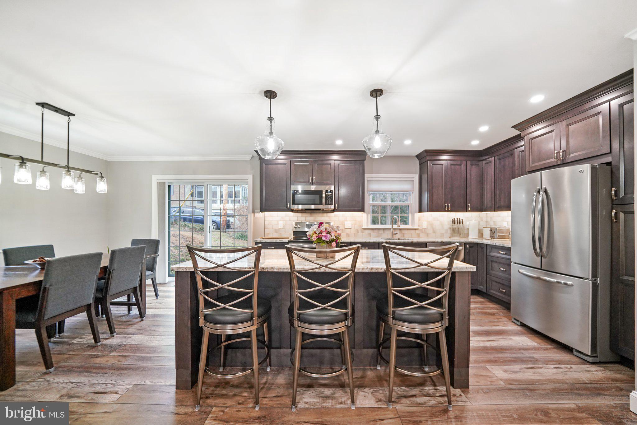 487 Kerr Lane Springfield, PA 19064 - Photo 6 of 48 a dining table with chairs and kitchen view