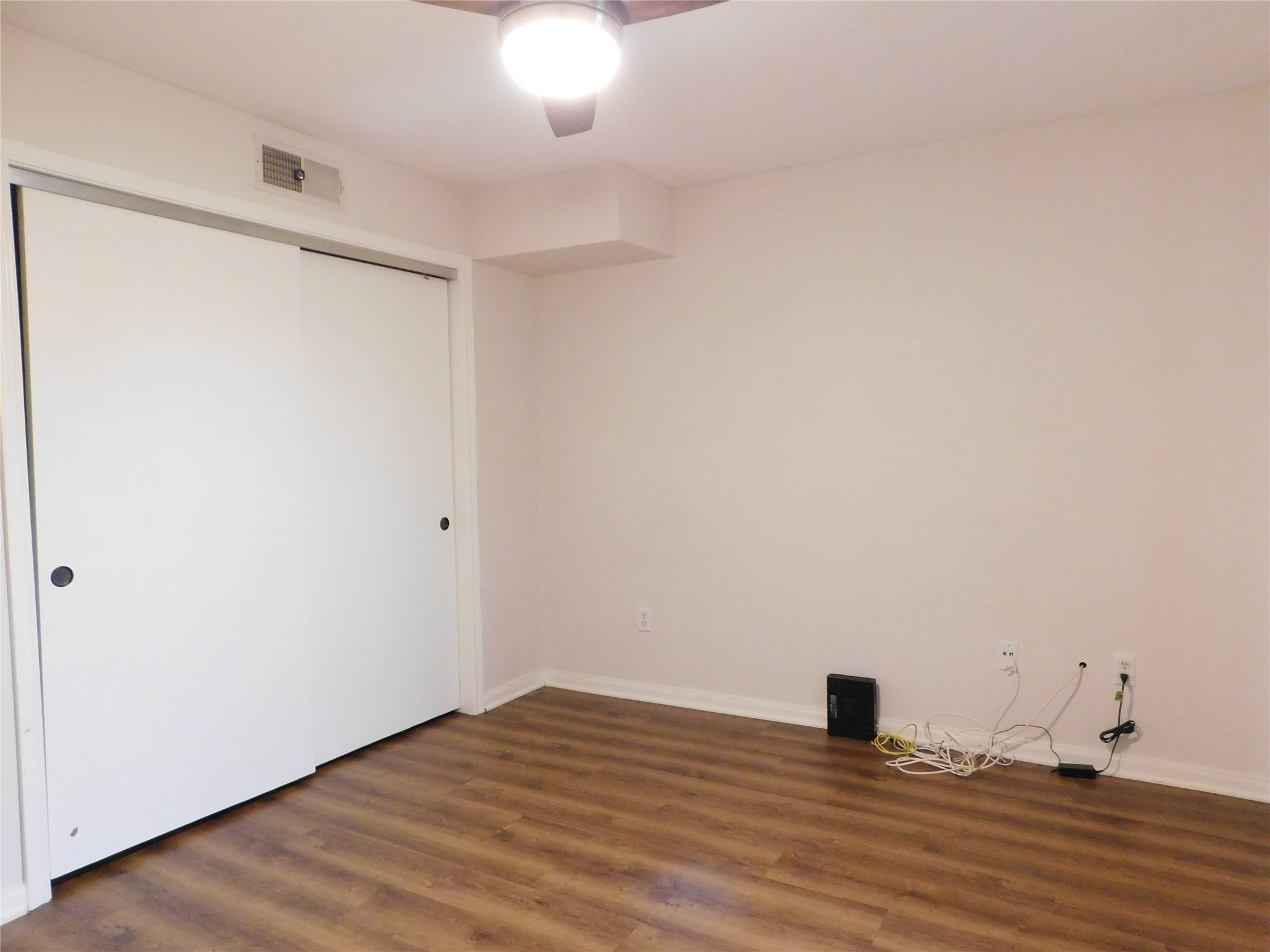 10101 South Gessner Road, Unit 912 Houston, TX 77071 - Photo 22 of 47 a view of empty room with wooden floor