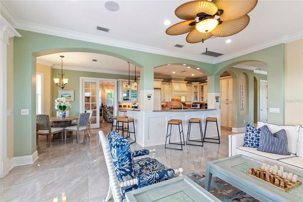 3523 West Shell Point Road Ruskin, FL 33570 - Photo 11 of 89 a living room with lots of furniture and view of kitchen