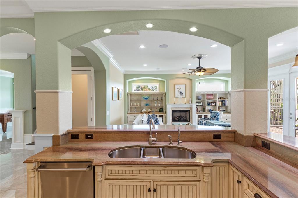 3523 West Shell Point Road Ruskin, FL 33570 - Photo 19 of 89 a kitchen with stainless steel appliances a sink stove and cabinets
