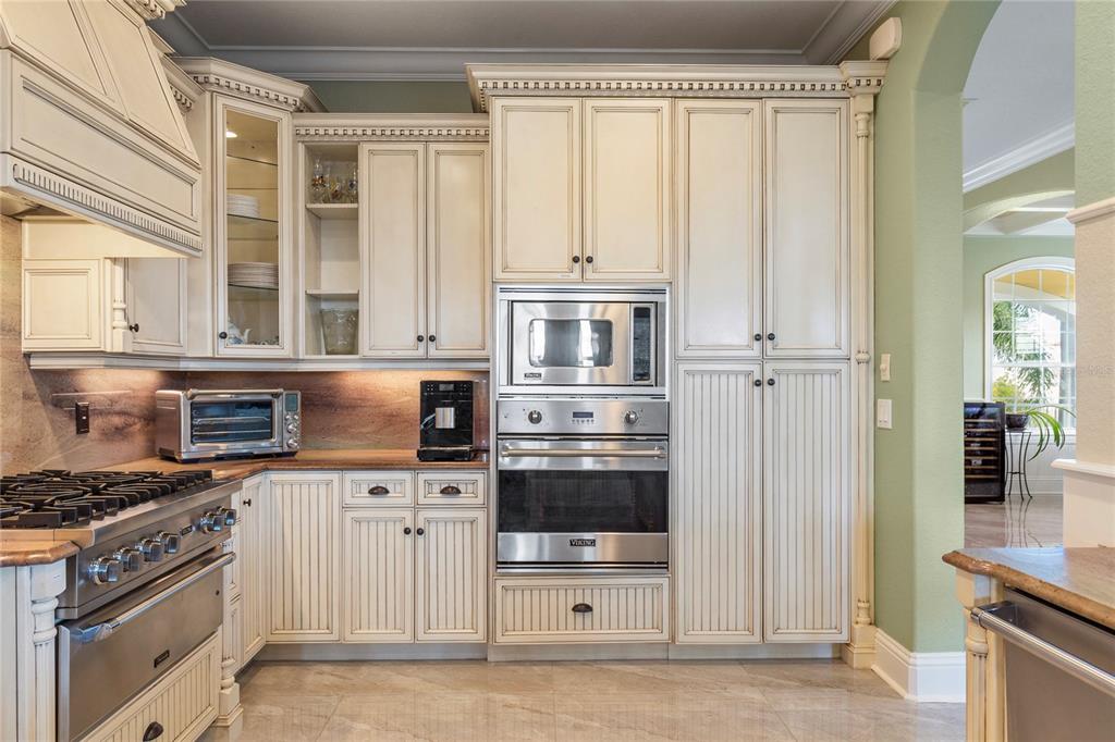 3523 West Shell Point Road Ruskin, FL 33570 - Photo 21 of 89 a kitchen with stainless steel appliances granite countertop a refrigerator and a stove