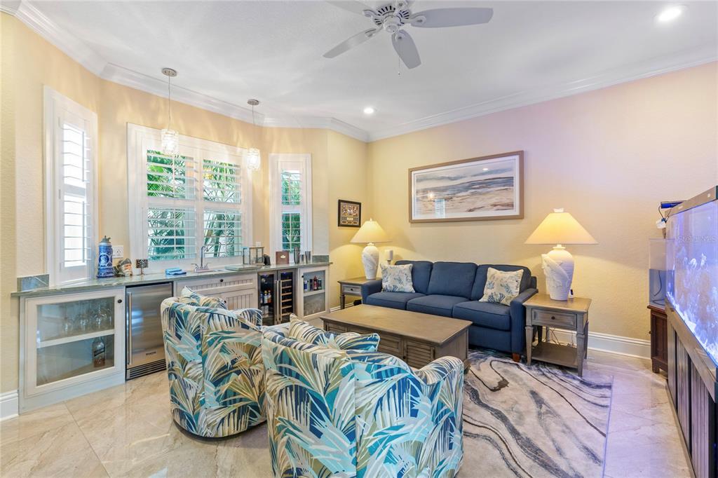 3523 West Shell Point Road Ruskin, FL 33570 - Photo 26 of 89 a living room with furniture and a large window