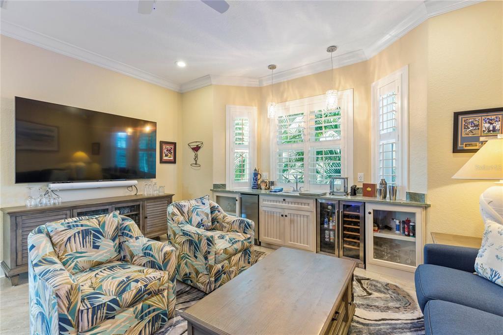 3523 West Shell Point Road Ruskin, FL 33570 - Photo 27 of 89 a living room with furniture and a flat screen tv
