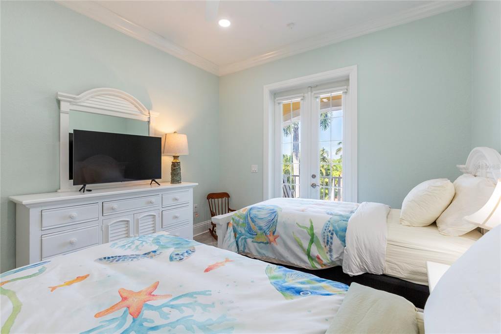 3523 West Shell Point Road Ruskin, FL 33570 - Photo 35 of 89 a bedroom with a bed and flat screen tv