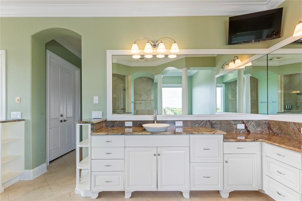 3523 West Shell Point Road Ruskin, FL 33570 - Photo 56 of 89 a bathroom with a sink and a mirror