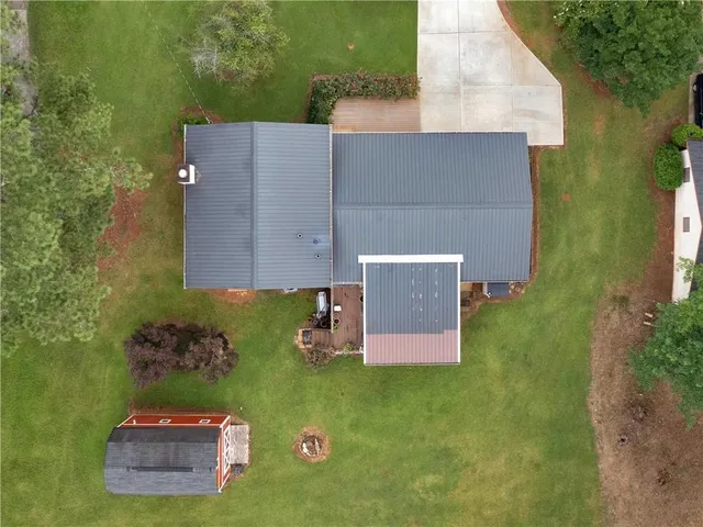 an aerial view of a house with a garden