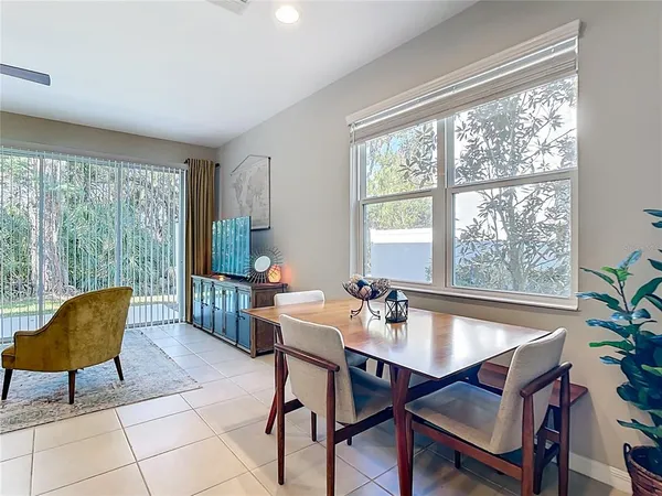 a dining room with furniture and window