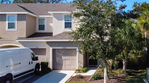 a front view of a house with garage