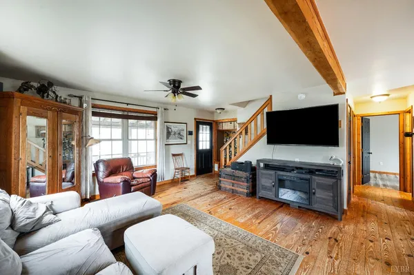 a kitchen with stainless steel appliances granite countertop a refrigerator a stove and a sink