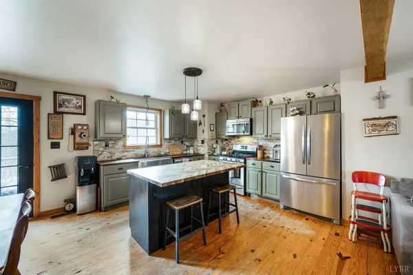 a kitchen with a sink stove and microwave