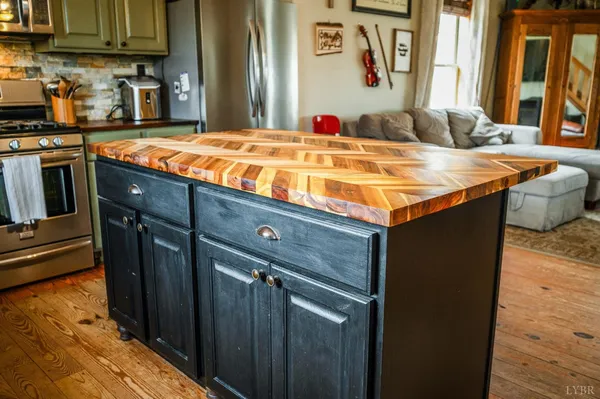 a view of a dining room with furniture and a window