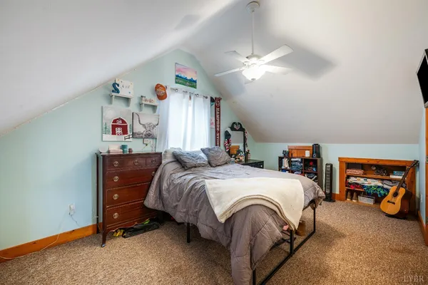 a bed room with a bed and a window