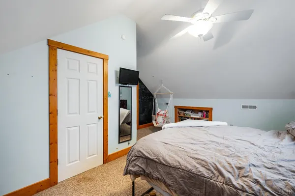 a bedroom with a bed and furniture