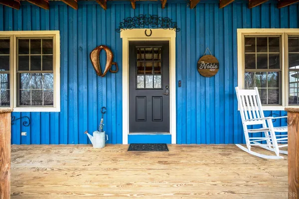a view of porch with wooden floor