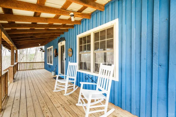 a view of porch with wooden floor