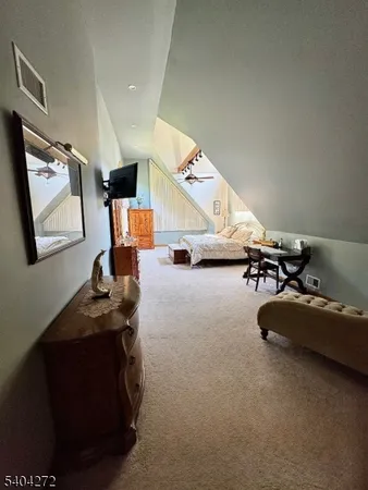 a view of a room with workspace and mirror
