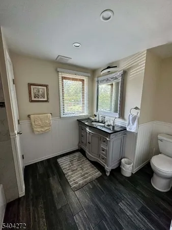 a room with wooden floors and glass door