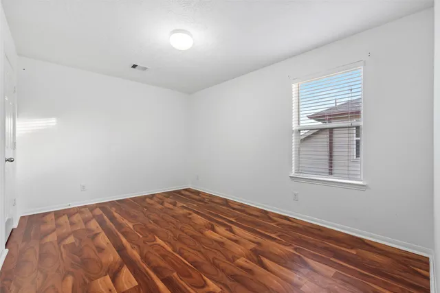 a view of a house with backyard and porch