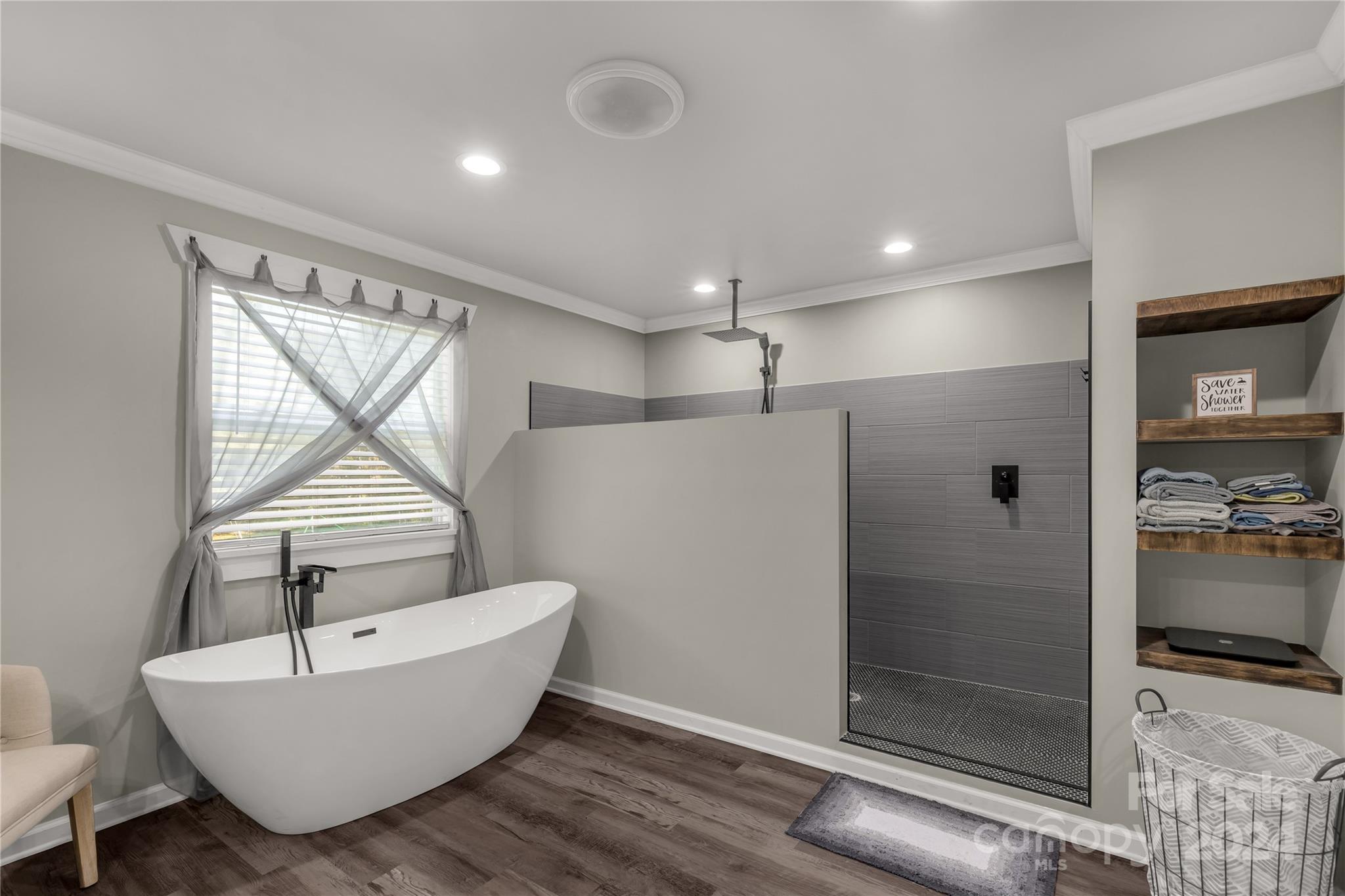 3593 Taxahaw Road Lancaster, SC 29720 - Photo 13 of 23 a bathroom with a bathtub a sink and mirror