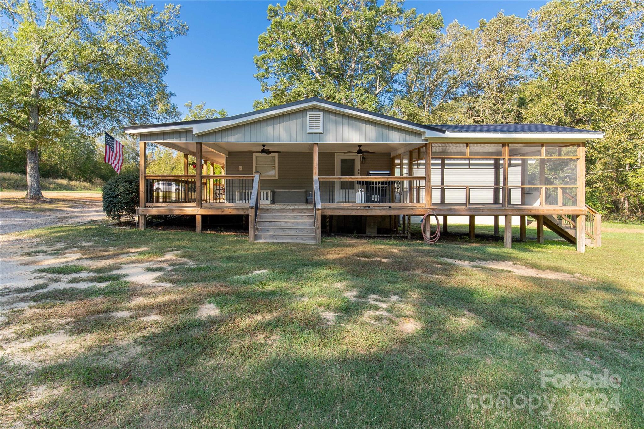 3593 Taxahaw Road Lancaster, SC 29720 - Photo 18 of 23 a front view of a house with a yard
