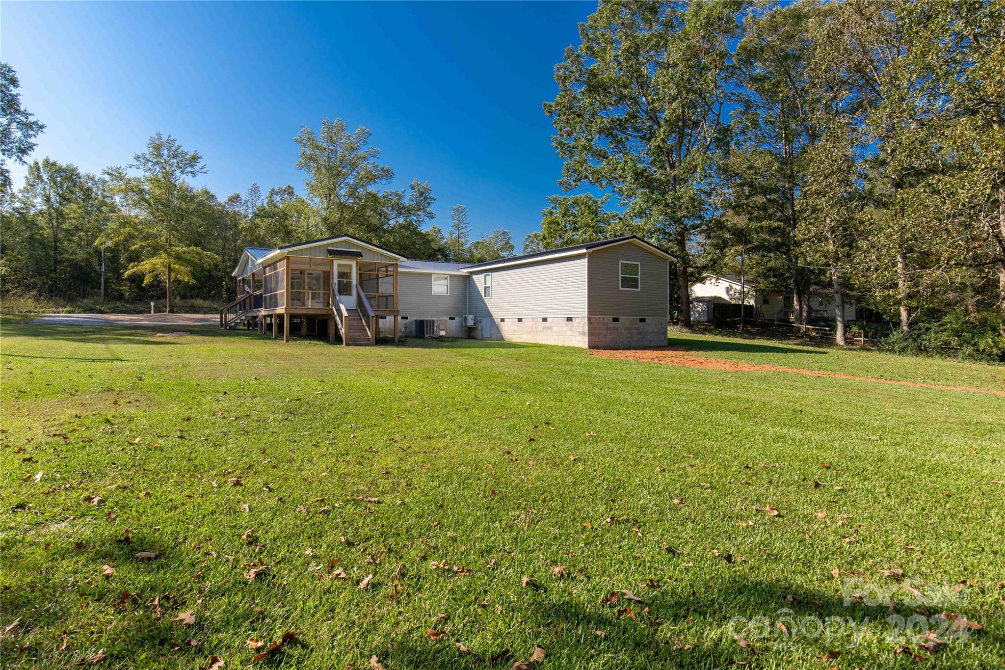 3593 Taxahaw Road Lancaster, SC 29720 - Photo 22 of 23 a front view of a house with yard and green space
