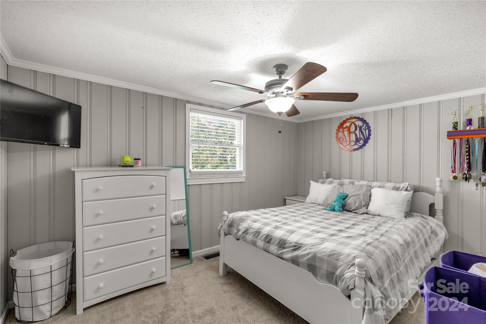 3593 Taxahaw Road Lancaster, SC 29720 - Photo 8 of 23 a bedroom with a large bed and a flat tv screen on dresser