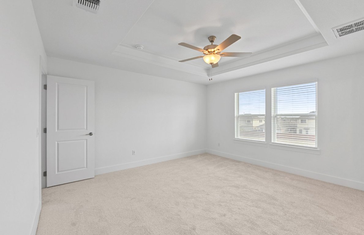 494 Tailwind Drive Kyle, TX 78640 - Photo 13 of 34 a view of an empty room with a window