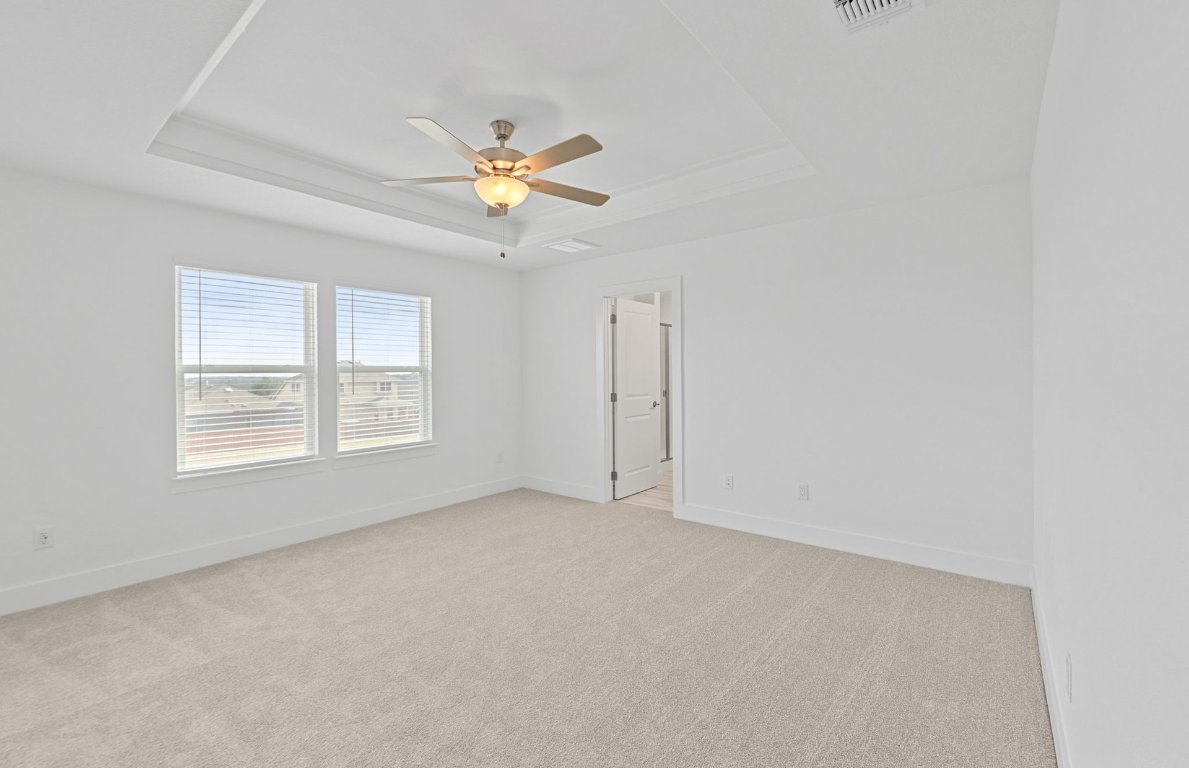 494 Tailwind Drive Kyle, TX 78640 - Photo 14 of 34 an empty room with a window and a fan