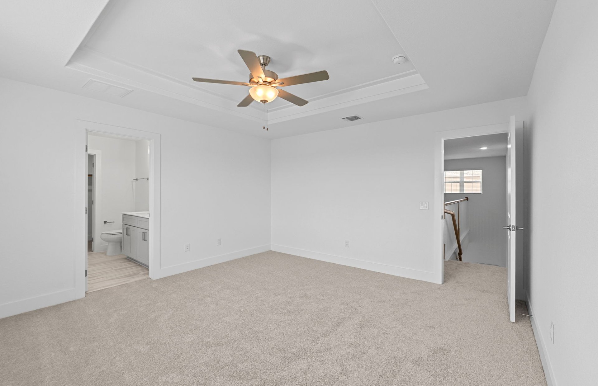 494 Tailwind Drive Kyle, TX 78640 - Photo 15 of 34 wooden floor in an empty room with a fan