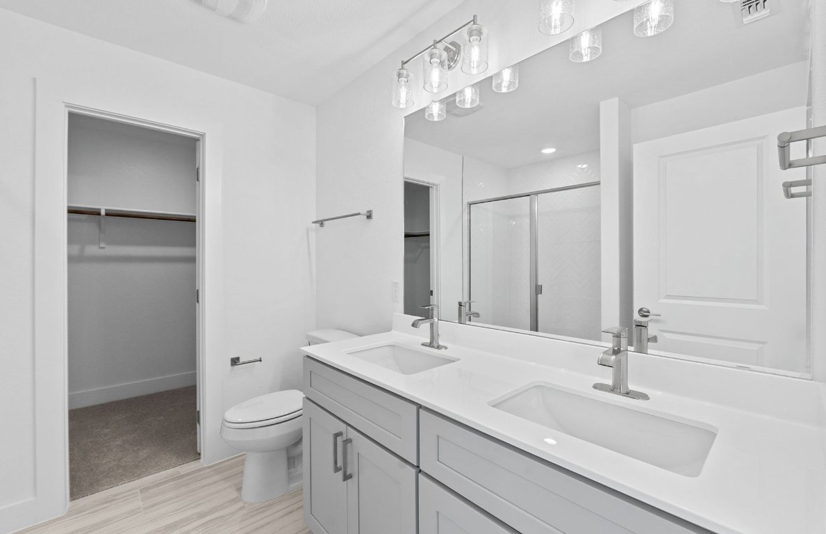 494 Tailwind Drive Kyle, TX 78640 - Photo 16 of 34 a bathroom with a sink a toilet and shower