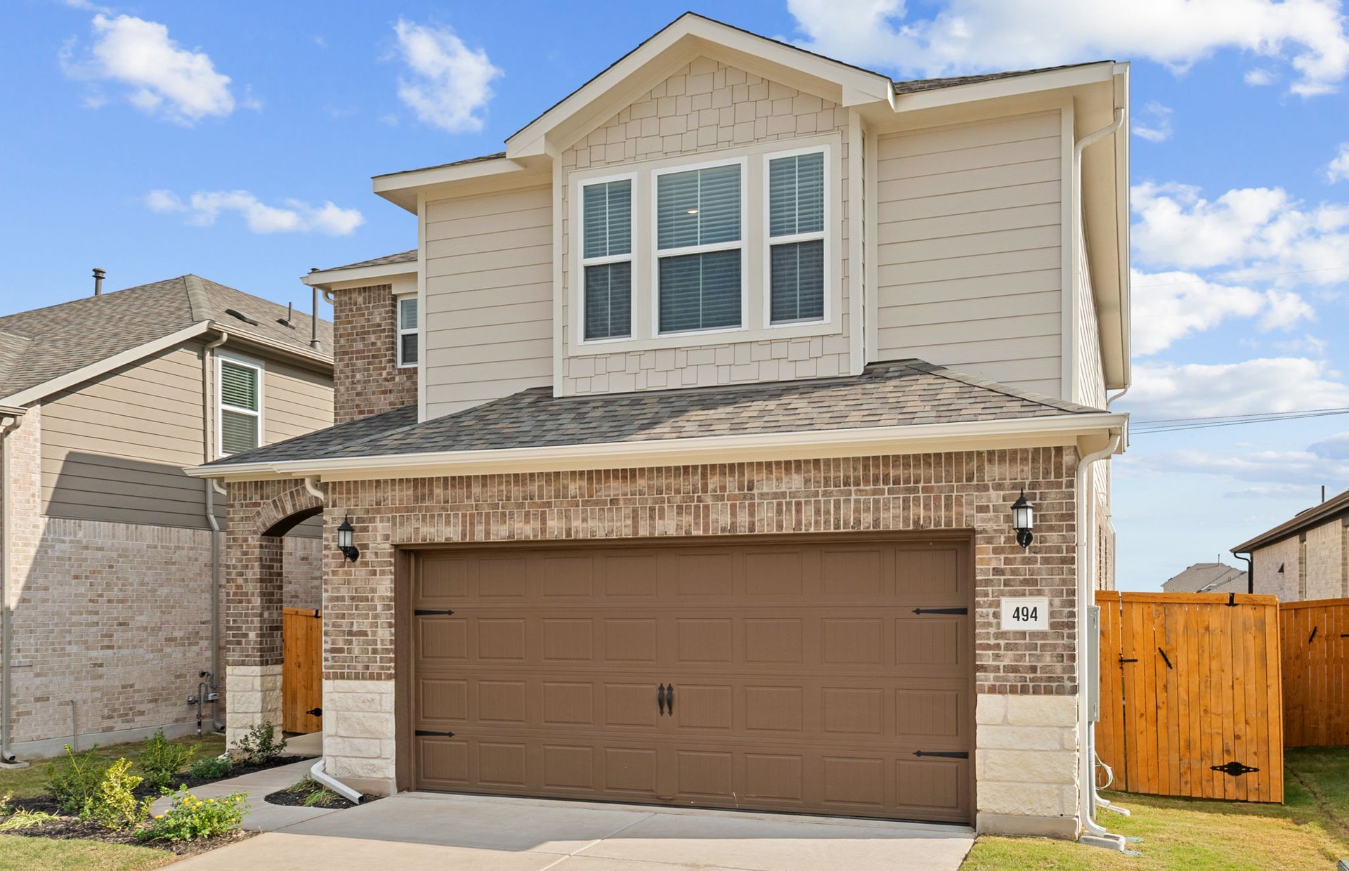494 Tailwind Drive Kyle, TX 78640 - Photo 2 of 34 a front view of a house with a yard