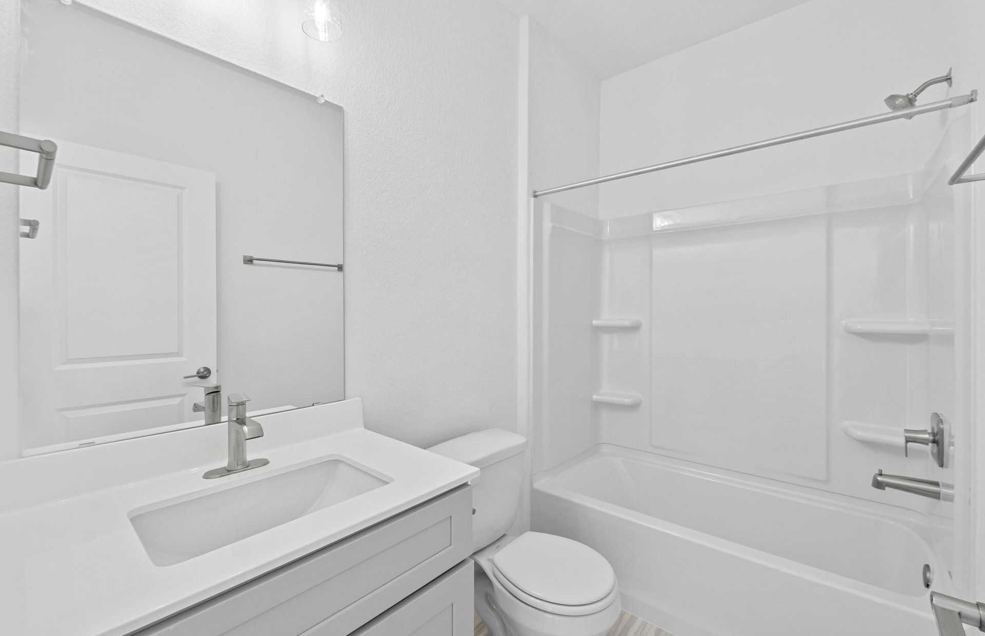 494 Tailwind Drive Kyle, TX 78640 - Photo 23 of 34 a bathroom with a sink toilet a bathtub and shower