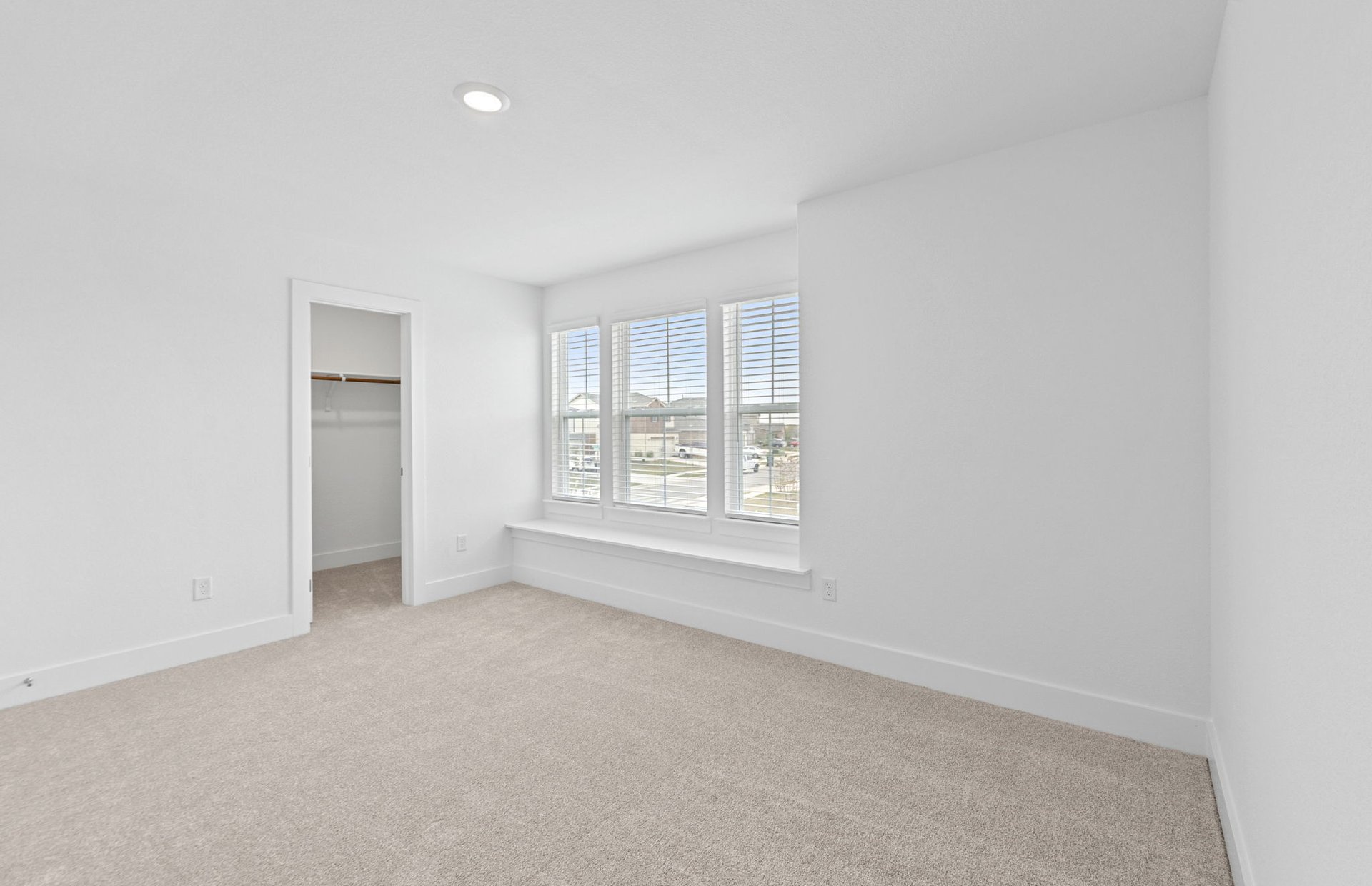 494 Tailwind Drive Kyle, TX 78640 - Photo 25 of 34 an empty room with windows and closet