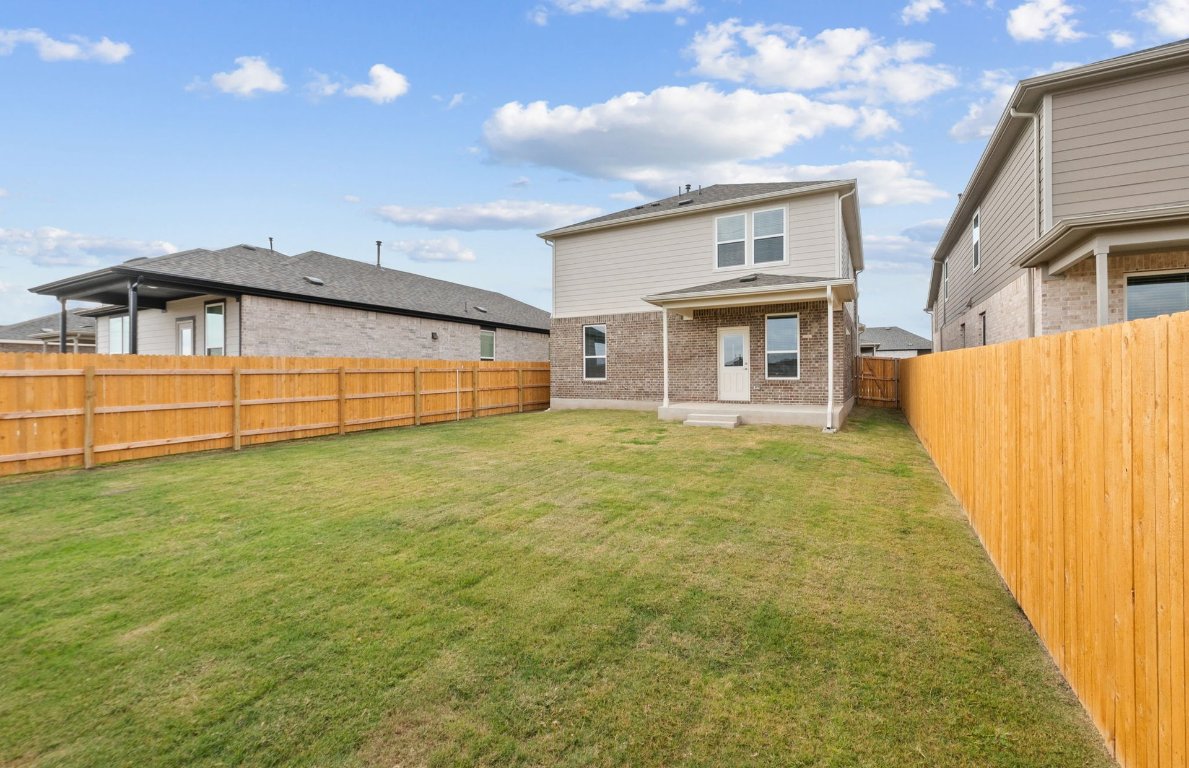 494 Tailwind Drive Kyle, TX 78640 - Photo 31 of 34 a view of a house with a backyard