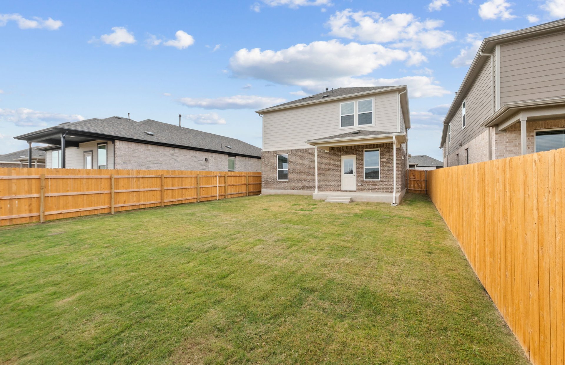 494 Tailwind Drive Kyle, TX 78640 - Photo 31 of 34 a view of a house with a backyard