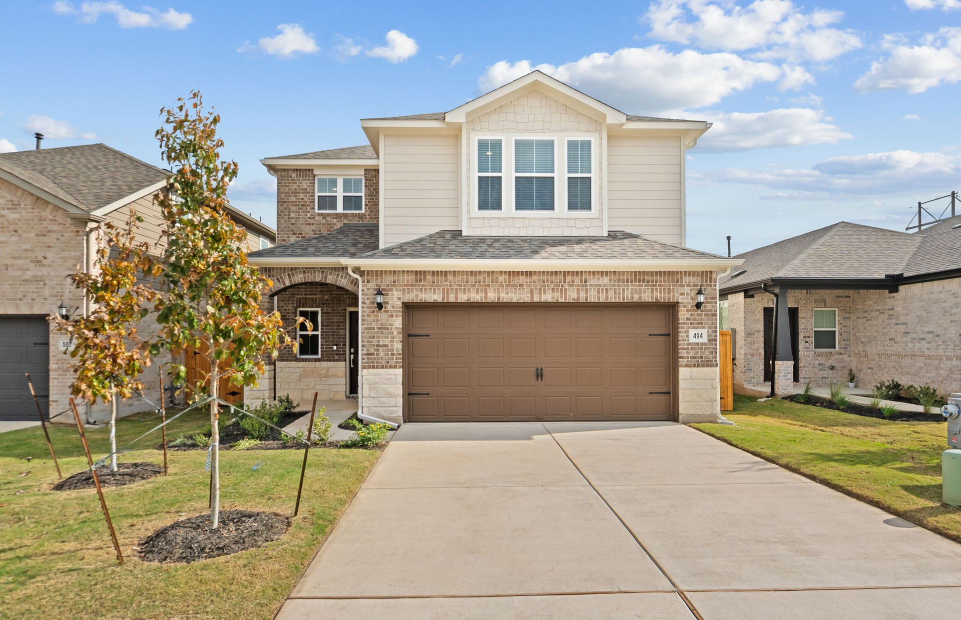 494 Tailwind Drive Kyle, TX 78640 - Photo 4 of 34 a front view of a house with a yard